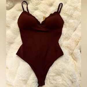 - SKIMS PUSH-UP BODYSUIT 
Burgundy- Brownish
Not available online anymore!